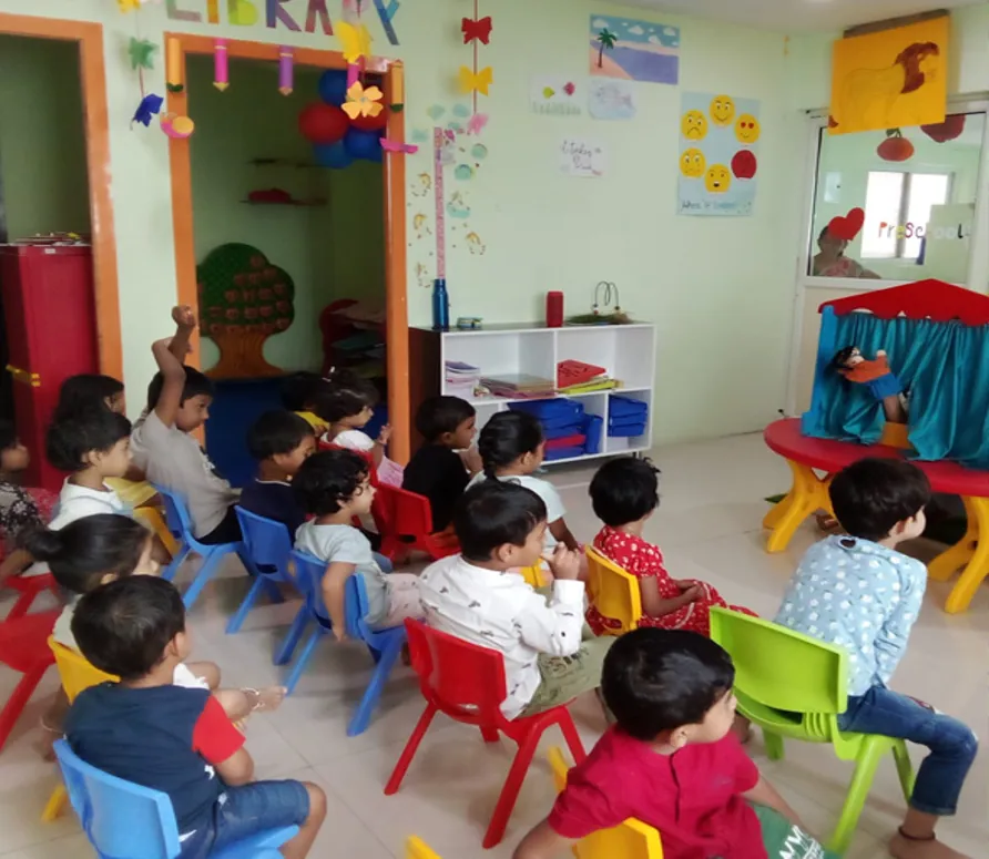 Children sitting together during circle time in a Kidzlore classroom