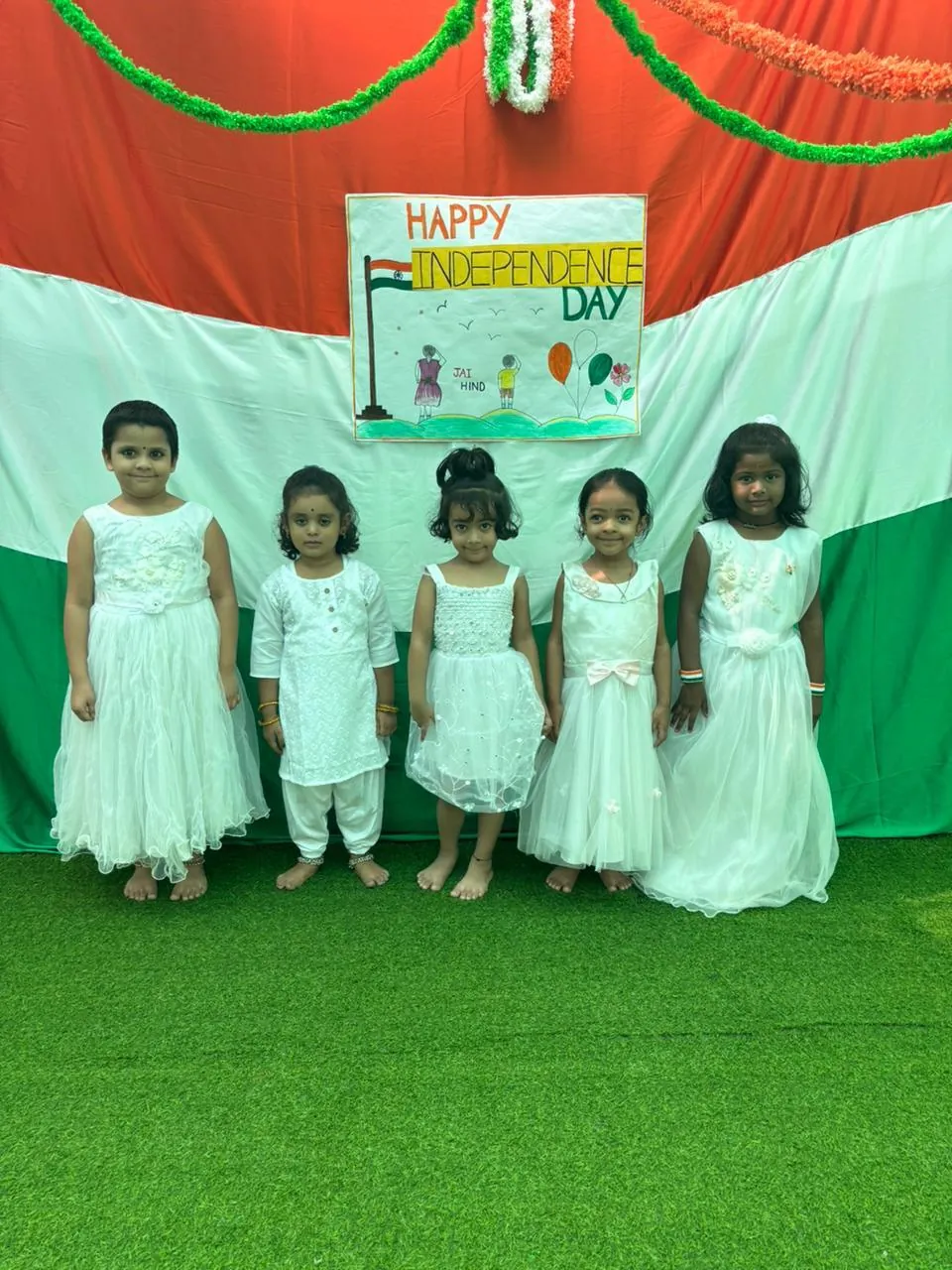 Children in mint green outfits on Independence Day
