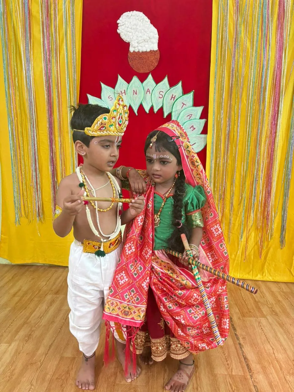 Two children dressed as Krishna and Radha