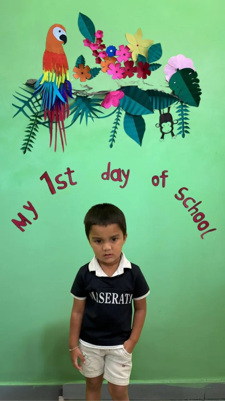A child on a decorated 'My first day at school' seat