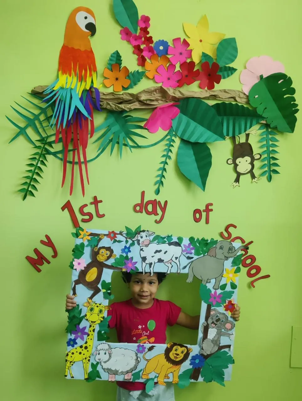 A child on their first day, in a decorated photo frame